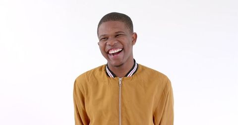 Smiling Young Man in Casual Jacket on White Background