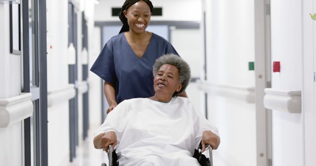 Nurse Pushing Elderly Patient in Wheelchair Down Hospital Corridor - Download Free Stock Images Pikwizard.com