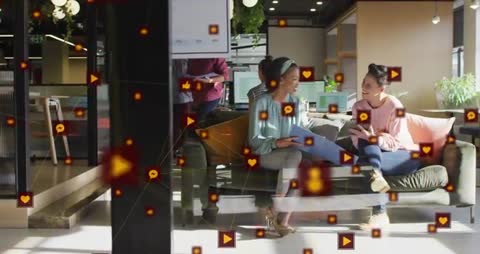 Women Utilizing Mobile Technology in Modern Office Environment