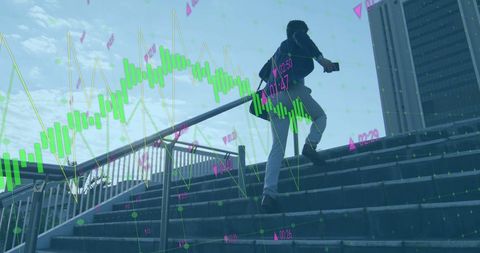 Businessman walking upstairs with digital financial graphics overlay