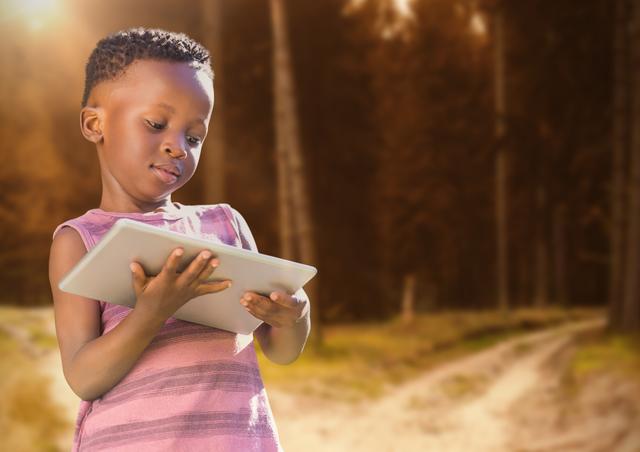child on tablet in forest trees - Download Free Stock Photos Pikwizard.com