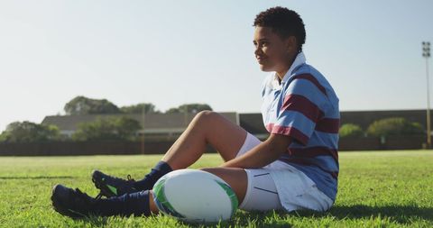 Teenage Girl Relaxing on Rugby Field After Practice - Download Free Stock Images Pikwizard.com
