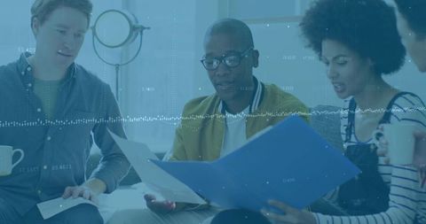 Team collaboration in modern office setting with documents