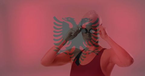 Albanian female swimmer adjusting goggles