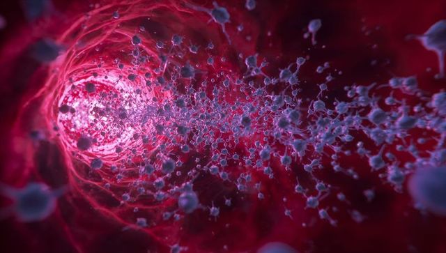 Streaming nanoparticles flowing through red microchannel toward luminous aperture