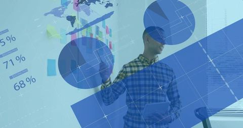 Asian male analyst interacting with digital data in modern office