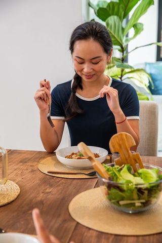 Woman Enjoying Healthy Meal in Cozy Home Interior Setting