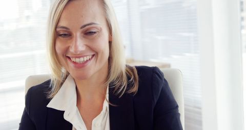 Smiling Businesswoman in a Modern Office Setting - Download Free Stock Images Pikwizard.com