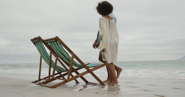 Couple Relaxing at Seaside Strolling on Empty Beach - Download Free Stock Images Pikwizard.com