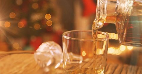 Cozy Christmas Drink Pouring Amidst Twinkling Lights - Download Free Stock Images Pikwizard.com