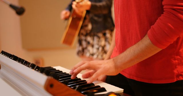 Musicians Collaborating on Guitar and Keyboard Music in Studio - Download Free Stock Images Pikwizard.com