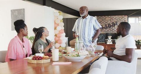 Happy Family Celebrating Retirement at Home Gathering