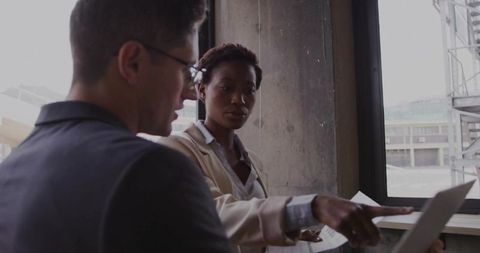 Executives Analyzing Information on Office Laptop