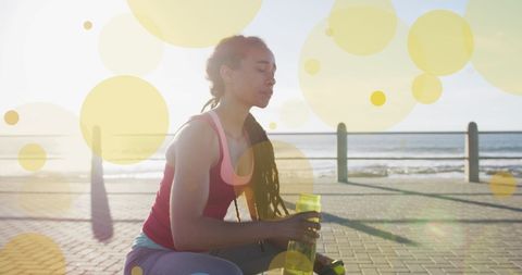 Woman enjoying refreshing break on sunny promenade