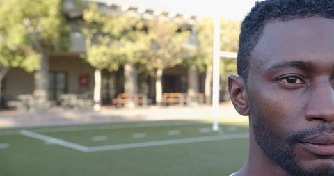 African American Man On Turf Field Highlighting Athletic Focus