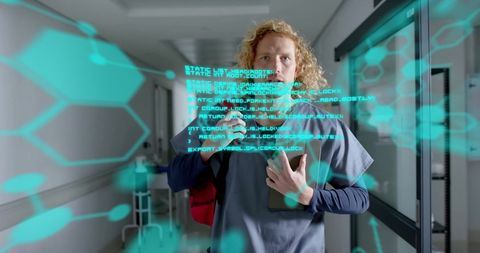 male doctor analyzing digital scientific data in corridor - Download Free Stock Images Pikwizard.com