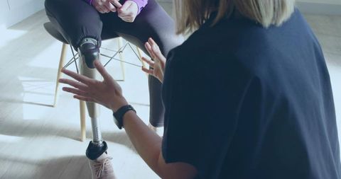 Therapist Assisting Prosthetic Leg Adjustment