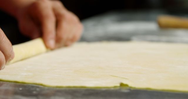 Hands Rolling Dough for Pastry Preparation on Floured Surface - Download Free Stock Images Pikwizard.com