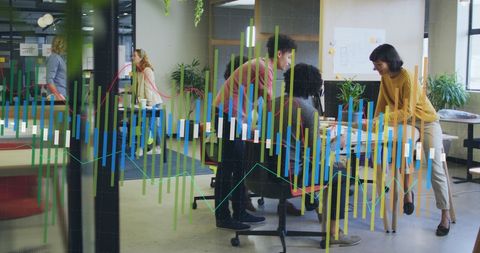 Diverse team discusses architectural models with overlay graphs