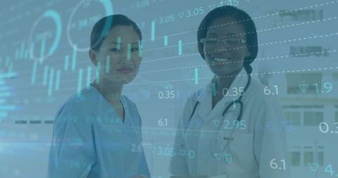 Female medical professionals analyzing healthcare data charts