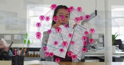Korean Businesswoman Presenting Data with Pink Network Visualization and Analytics Charts
