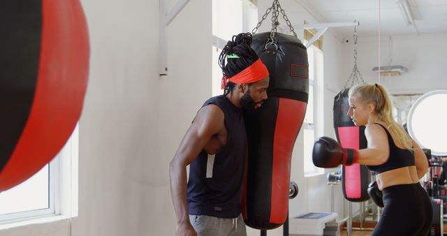 Boxing Coach Training Female Boxer at Gym During Workout - Download Free Stock Images Pikwizard.com