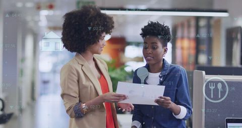 Colleagues Discussing Reports with Futuristic Augmented Reality