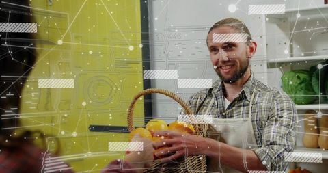 Male vendor offering oranges with digital technology overlay