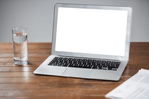 transparent laptop screen on wooden table with water glass - Download Free Stock Videos Pikwizard.com