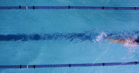 Competitive Swimmer in Pool Showing Powerful Stroke with Copy Space - Download Free Stock Images Pikwizard.com