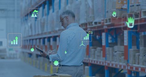 Warehouse Manager Using Tablet with Eco and Data Overlay - Download Free Stock Images Pikwizard.com
