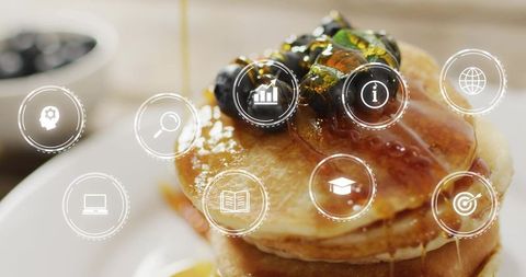 Warm Pancake Stack with Blueberries Pistachios Syrup Drizzle and Digital Interface Overlay