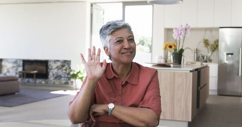 Happy Senior Woman in Modern Home with Warm Smile