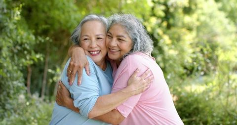 Senior Women Friends Embracing and Smiling at Park - Download Free Stock Images Pikwizard.com