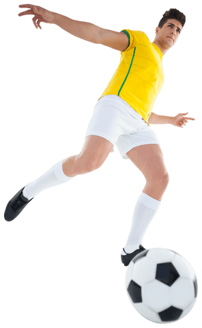 Focused football player kicking soccer ball on transparent background