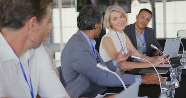 Diverse Business Team Engaging in Meeting Discussion at Conference Table - Download Free Stock Images Pikwizard.com