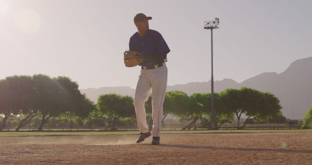 Baseball Player in Action on Sunny Field - Download Free Stock Images Pikwizard.com