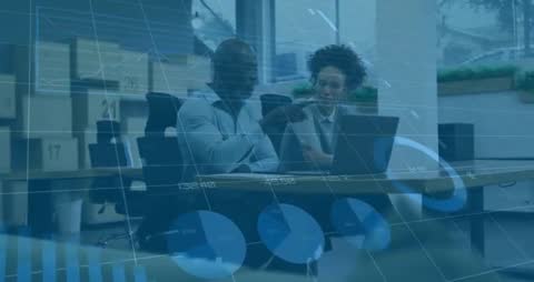 Business Partners Analyzing Data on Laptop with Digital Charts