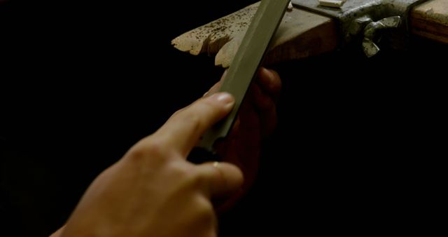 Craftsman Sharpening Knife on Whetstone with Precision - Download Free Stock Images Pikwizard.com