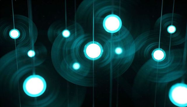 Teal neon orb light installation with concentric ripples, vertical light trails and bokeh