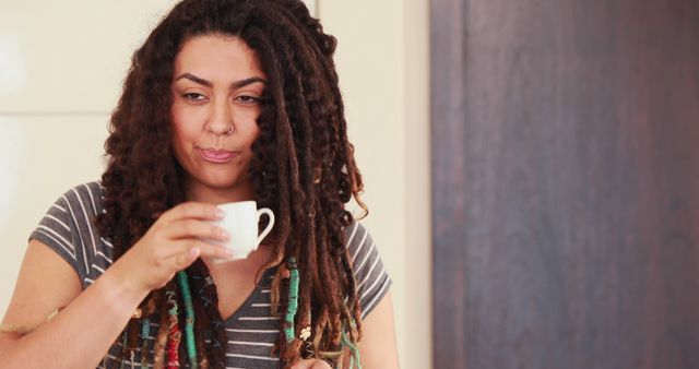 Relaxed Woman with Dreadlocks Drinking Espresso at Home - Download Free Stock Images Pikwizard.com