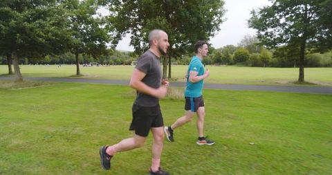 Men Jogging in Park Enjoying Tailored Fitness Outdoors
