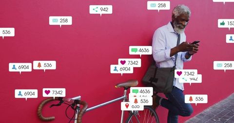 Senior man engaging on smartphone with notification icons