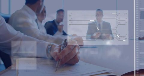 Business team note-taking during executive presentation with digital data overlays and charts