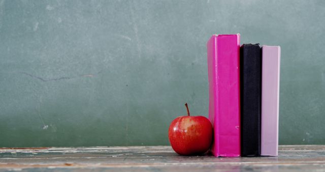 Books and Apple on Wooden Desk with Green Chalkboard Background - Download Free Stock Images Pikwizard.com