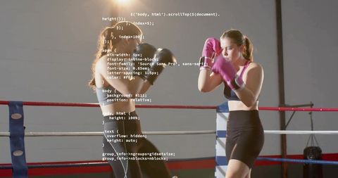 Female Boxers Sparring and Guarding in Gym Ring with Code Overlay, Fitness Training Session