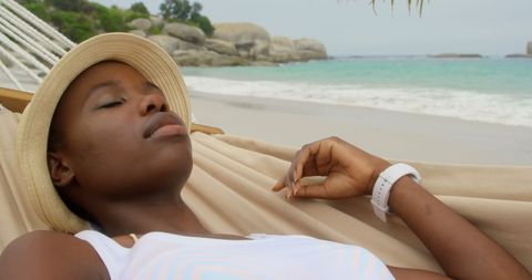Woman Relaxing in a Hammock by the Seaside Beach, Tranquil Day - Download Free Stock Images Pikwizard.com