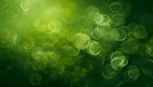 Shimmering green bokeh circles drifting over luminous abstract backdrop with ring highlights