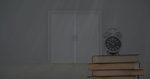 Alarm Clock on Stack of Books with Light Streaming - Download Free Stock Images Pikwizard.com
