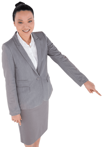 Smiling asian businesswoman confidently pointing on transparent background